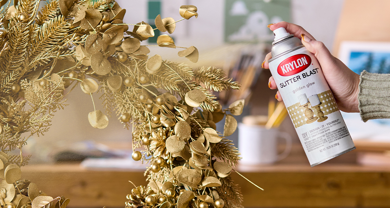 Spraying the wreath with Krylon Glitter Blast